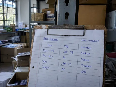 Handwritten stock count on a clipboard, ready to summarise.